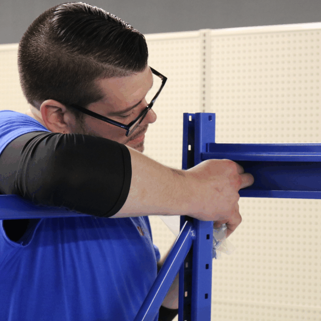 ProVantage team member installing store fixtures during post-holiday retail assessments