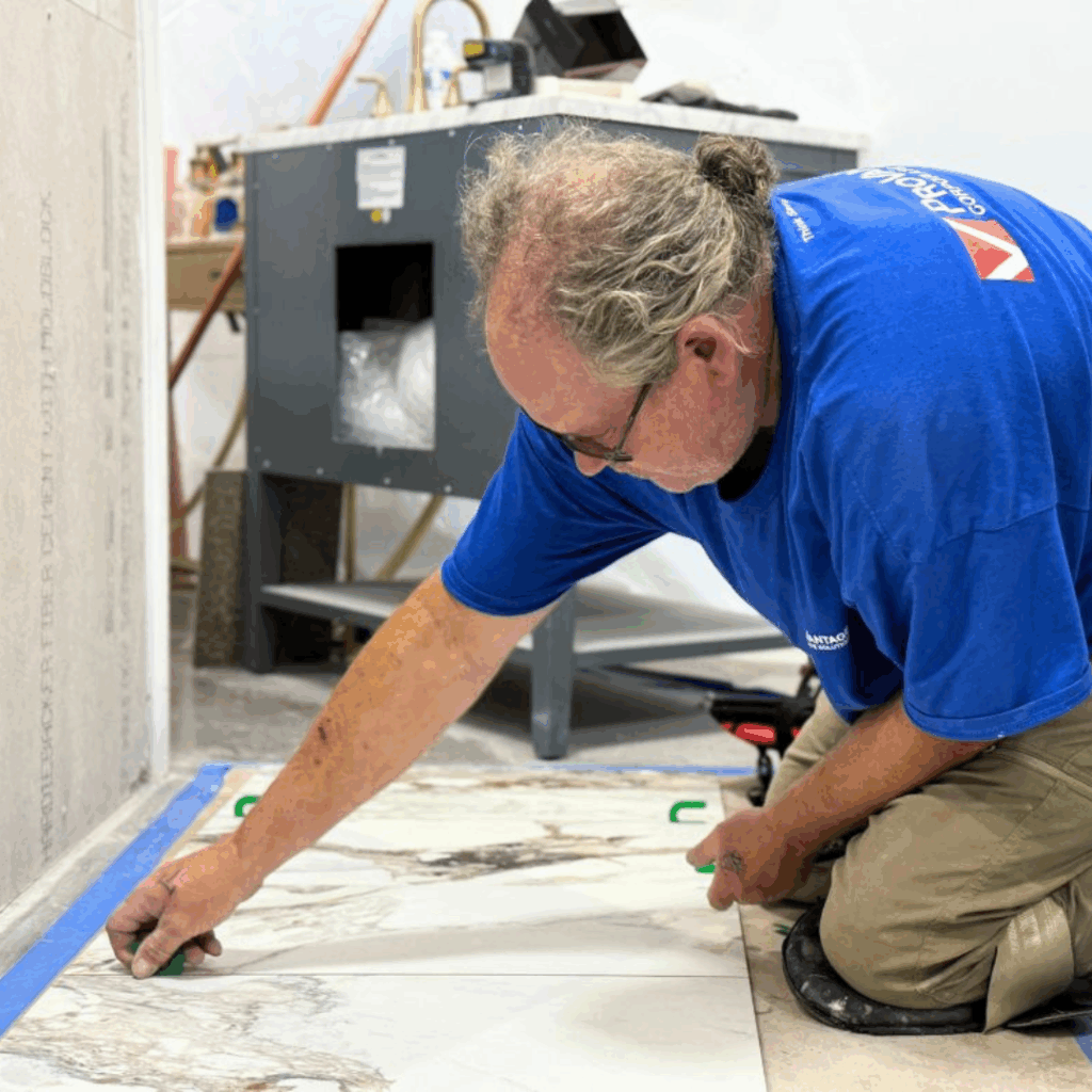 Technician measuring materials for a retail update during post-holiday retail assessments